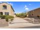 Gated driveway that provides privacy between neighboring homes at 1236 E Mescal St, Phoenix, AZ 85020