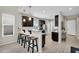 Kitchen with stainless steel appliances, pendant lighting, breakfast bar, and light wood floors at 1236 E Mescal St, Phoenix, AZ 85020