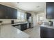 Well-equipped kitchen featuring granite countertops, stainless steel appliances, and ample cabinet space at 1236 E Mescal St, Phoenix, AZ 85020