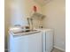 Convenient laundry area features modern white washer and dryer for easy chore completion at 1236 E Mescal St, Phoenix, AZ 85020