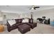 Upstairs living room featuring a large brown leather sectional sofa and a desk area at 1236 E Mescal St, Phoenix, AZ 85020