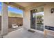Covered patio with a view of a well-kept backyard and sliding glass door at 1236 E Mescal St, Phoenix, AZ 85020