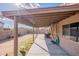 Spacious covered back patio with large backyard and convenient access to outdoor living space at 13547 W Peck Dr, Litchfield Park, AZ 85340