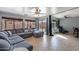 Expansive living room featuring a plush sofa, sliding glass doors, and stylish decor at 13547 W Peck Dr, Litchfield Park, AZ 85340