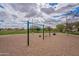 Playground area with swings, climbing structures, and soft sand surfacing, perfect for play at 13547 W Peck Dr, Litchfield Park, AZ 85340