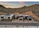 Aerial shot showcasing modern desert homes nestled against a striking mountain backdrop at 14715 N Adero Canyon Dr, Fountain Hills, AZ 85268