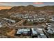 Breathtaking aerial shot of upscale desert homes nestled in the mountainous landscape at sunset at 14715 N Adero Canyon Dr, Fountain Hills, AZ 85268