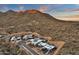 Stunning aerial view of modern desert homes nestled in the hills at sunset at 14715 N Adero Canyon Dr, Fountain Hills, AZ 85268