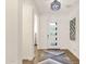 Inviting entryway with a modern front door, stylish light fixture, and decorative wall art at 14715 N Adero Canyon Dr, Fountain Hills, AZ 85268