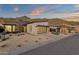 Stunning single-story home with a modern design, desert landscaping, and a backdrop of picturesque mountain views at 14715 N Adero Canyon Dr, Fountain Hills, AZ 85268
