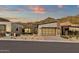 Contemporary home with a modern garage door, desert landscaping, and mountain views at 14715 N Adero Canyon Dr, Fountain Hills, AZ 85268