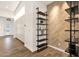 Hallway featuring a contemporary shelving unit with decorative wall and tile flooring at 14715 N Adero Canyon Dr, Fountain Hills, AZ 85268