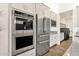 Gourmet kitchen featuring stainless steel appliances, double ovens, and custom cabinetry at 14715 N Adero Canyon Dr, Fountain Hills, AZ 85268