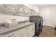 The well-equipped laundry room features granite counters, ample storage and modern appliances at 14715 N Adero Canyon Dr, Fountain Hills, AZ 85268
