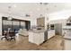 Spacious open concept home with kitchen island and comfortable living area with fireplace at 14715 N Adero Canyon Dr, Fountain Hills, AZ 85268
