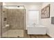 Bright bathroom with a glass enclosed shower and modern standalone bathtub at 14715 N Adero Canyon Dr, Fountain Hills, AZ 85268
