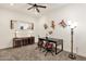 Home office with a ceiling fan, neutral carpet, contemporary furniture, and unique decor at 14715 N Adero Canyon Dr, Fountain Hills, AZ 85268