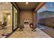 Inviting outdoor patio with comfortable seating and a fireplace with desert views at 14715 N Adero Canyon Dr, Fountain Hills, AZ 85268