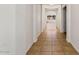 Long hallway featuring tile flooring and recessed lighting at 14994 W Charter Oak Rd, Surprise, AZ 85379