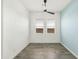 Bright bedroom with a modern ceiling fan, natural light, and neutral walls, offering a blank canvas at 15720 S 182Nd Ave, Goodyear, AZ 85338