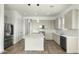 Spacious kitchen with a center island, stainless steel appliances, stylish pendant lighting, and a tile backsplash at 15720 S 182Nd Ave, Goodyear, AZ 85338