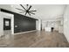 Inviting living room with tile floors, large windows, and open layout, perfect for entertaining at 15720 S 182Nd Ave, Goodyear, AZ 85338