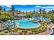 A large luxurious community pool with palm trees, lounge chairs, and a splash pad for Gathering fun at 15720 S 182Nd Ave, Goodyear, AZ 85338