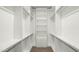 Spacious walk-in closet with adjustable shelving and ample storage space, designed for optimal organization at 15720 S 182Nd Ave, Goodyear, AZ 85338