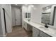 Elegant bathroom features double sinks, sleek cabinetry, and modern fixtures for a luxurious feel at 15782 W Cheryl Dr, Waddell, AZ 85355
