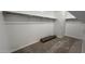 Walk-in closet features shelving and carpeted flooring at 15782 W Cheryl Dr, Waddell, AZ 85355