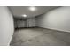 Spacious garage featuring multiple bays and a concrete floor at 15782 W Cheryl Dr, Waddell, AZ 85355