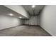 This garage has multiple doors and concrete floors at 15782 W Cheryl Dr, Waddell, AZ 85355