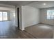 Open living space features neutral carpet and tile floors at 15782 W Cheryl Dr, Waddell, AZ 85355
