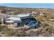 Aerial view of a luxury home with a pool and outdoor living space, set in a desert landscape at 15830 E Eagle Crest Rd, Fountain Hills, AZ 85268