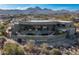 Desert home aerial view featuring a patio, pool, and stunning mountain backdrop at 15830 E Eagle Crest Rd, Fountain Hills, AZ 85268