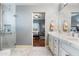 Well-lit bathroom featuring dual sinks, white marble and walk-in shower at 15830 E Eagle Crest Rd, Fountain Hills, AZ 85268