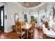 Charming dining room with hardwood floors, decorative ceiling, and large windows overlooking the garden at 15830 E Eagle Crest Rd, Fountain Hills, AZ 85268