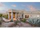 Inviting covered home entrance with outdoor seating and lush landscaping at 15830 E Eagle Crest Rd, Fountain Hills, AZ 85268