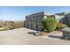 Expansive driveway leading to a large, modern home with multi-car garage and desert landscaping at 15830 E Eagle Crest Rd, Fountain Hills, AZ 85268