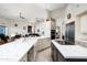 Gourmet kitchen with marble countertops, stainless steel appliances, and breakfast bar at 15830 E Eagle Crest Rd, Fountain Hills, AZ 85268