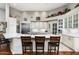 Well-equipped kitchen with white cabinetry, an oversized island, and marble countertops at 15830 E Eagle Crest Rd, Fountain Hills, AZ 85268