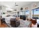 Open living room with fireplace, leather furniture, and picture windows with beautiful outdoor views at 15830 E Eagle Crest Rd, Fountain Hills, AZ 85268
