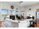 Bright living room with vaulted ceilings, fireplace, and picture windows with beautiful desert views at 15830 E Eagle Crest Rd, Fountain Hills, AZ 85268