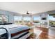Main bedroom showcasing hardwood floors, a ceiling fan, and scenic views from the large windows at 15830 E Eagle Crest Rd, Fountain Hills, AZ 85268