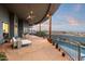Covered patio offering comfortable outdoor living with lounge seating and tranquil views of the pool and mountains at 15830 E Eagle Crest Rd, Fountain Hills, AZ 85268