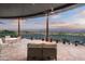 Inviting outdoor patio with comfortable seating, potted plants, and amazing mountain views at dusk at 15830 E Eagle Crest Rd, Fountain Hills, AZ 85268