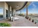 Spacious covered patio featuring comfortable seating, decorative plants, and stunning mountain views at 15830 E Eagle Crest Rd, Fountain Hills, AZ 85268