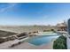 Sparkling backyard pool features a diving board, rock waterfall, and breathtaking mountain views at 15830 E Eagle Crest Rd, Fountain Hills, AZ 85268