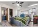 Bright bedroom with ceiling fan, closet and private bathroom at 17200 W Bell Rd # 1628, Surprise, AZ 85374