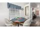 Cozy breakfast nook featuring a round table and window with blue accents at 17200 W Bell Rd # 1628, Surprise, AZ 85374